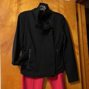 Black short jacket with side zipper fabric has some stretch and is form fitting